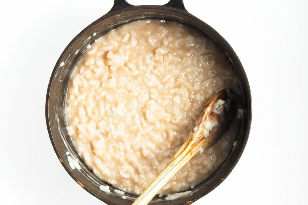 A mixture of  rice with coconut milk, sugar, salt, vanilla extract and cinnamon placed in a heavy bottomed saucepan.